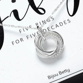 Sterling silver 50th birthday circle necklace with five rings.