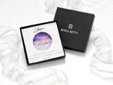 14k gold-plated sterling silver 6.5mm Libra zodiac stud earrings with CZ in Bijou Betty gift box with Libra card.