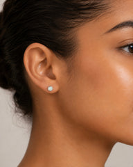 Opal birthstone sterling silver stud earrings modelled