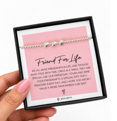 Three-heart stretch bracelet in a bright silver finish, shown as the main product image.