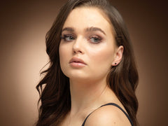 Model wearing gold filled black spinel stud earrings.