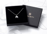 Sterling silver angel wing necklace in Bijou Betty gift box.