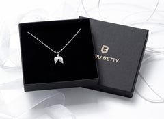 Sterling silver angel wing necklace in Bijou Betty gift box.