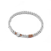 Sterling silver 30th birthday heart bracelet with rose gold rings.