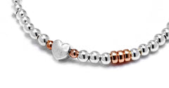 Sterling silver 30th birthday heart bracelet with rose gold rings.