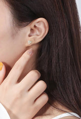 Gold plated leaf CZ stud earrings in Bijou Betty gift box.