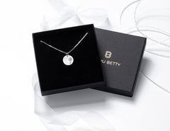 Sterling silver dandelion necklace in Bijou Betty gift box.