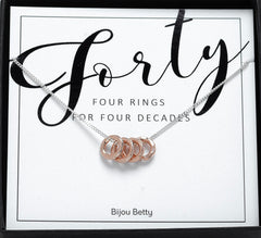 Sterling silver 40th birthday 4 ring necklace with rose gold.