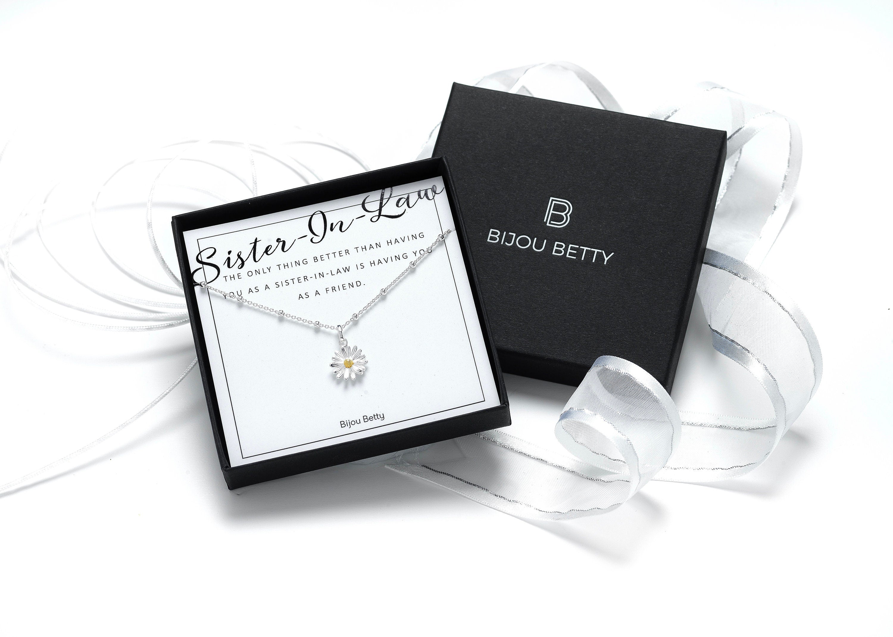Sterling silver daisy necklace in Bijou Betty gift box with sister-in-law card, ideal for birthday gifts.