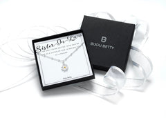 Sterling silver daisy necklace in Bijou Betty gift box with sister-in-law card, ideal for birthday gifts.