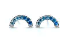 Sterling silver rainbow CZ stud earrings with ombre blue in Bijou Betty gift box.