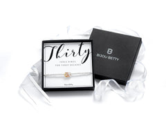 Milestone birthday decades bracelet, sterling silver, stretch fit, three hammered rings, gift-boxed with Bijou Betty card.