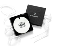 Ceramic 40th birthday ornament in gift box with tissue.