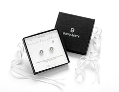 Sterling silver 10mm circle stud earrings with black CZ in Bijou Betty luxury gift box with bonus daughter card, ideal for birthdays.
