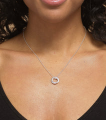 Model wearing sterling silver friendship three ring necklace.