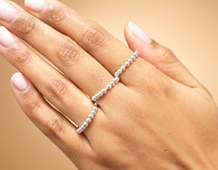 Model wearing sterling silver fidget spinner ring.