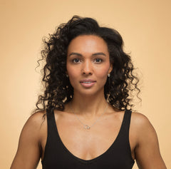 Model wearing sterling silver daughter circle necklace.