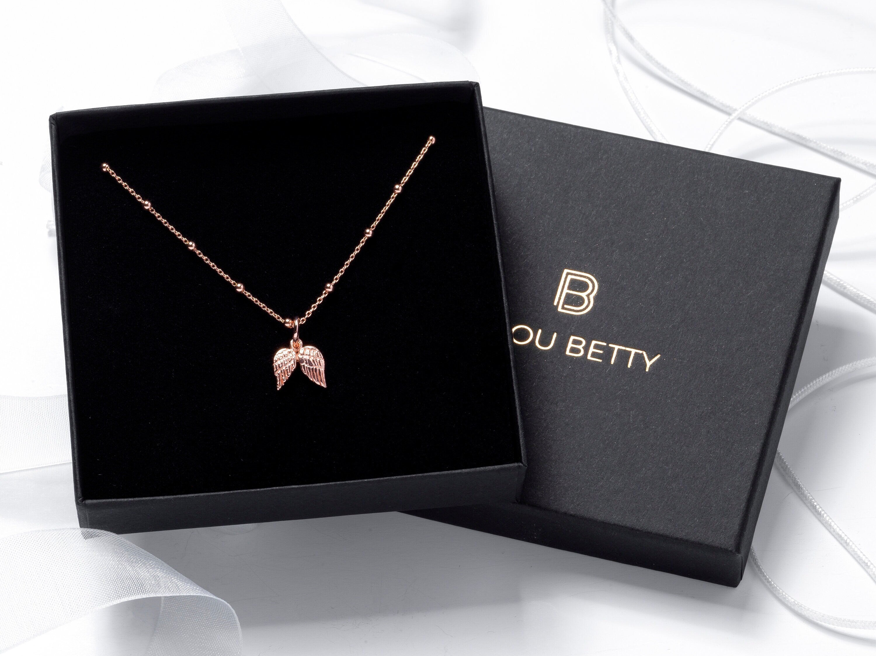 Rose Gold Angel Wing Sympathy Necklace in gift box.