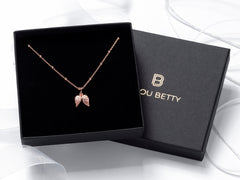 Rose Gold Angel Wing Sympathy Necklace in gift box.