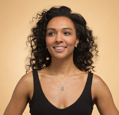 Model wearing sterling silver 60th birthday 6 ring necklace.