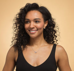 Model wearing sterling silver aunt niece heart necklace.