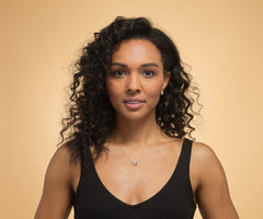 Model wearing a sterling silver heart necklace.