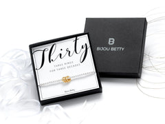 Sterling silver 30th birthday bracelet with 3 rings in Bijou Betty gift box.