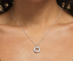Model wearing sterling silver 40th birthday 4 ring necklace.