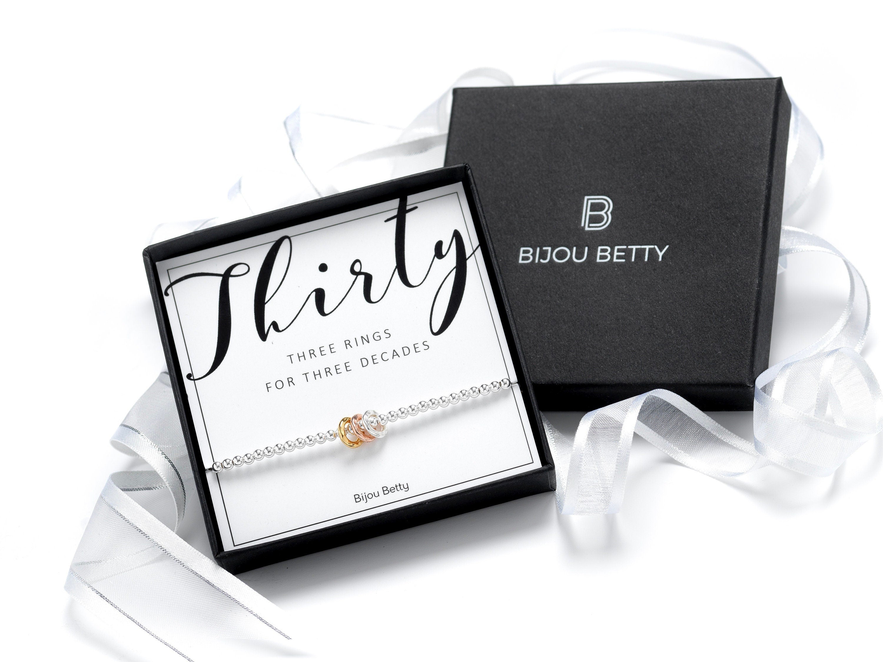 Sterling silver decades bracelet, milestone birthday gift, 925 silver with mixed-metal rings, stretch cord, in Bijou Betty gift box.