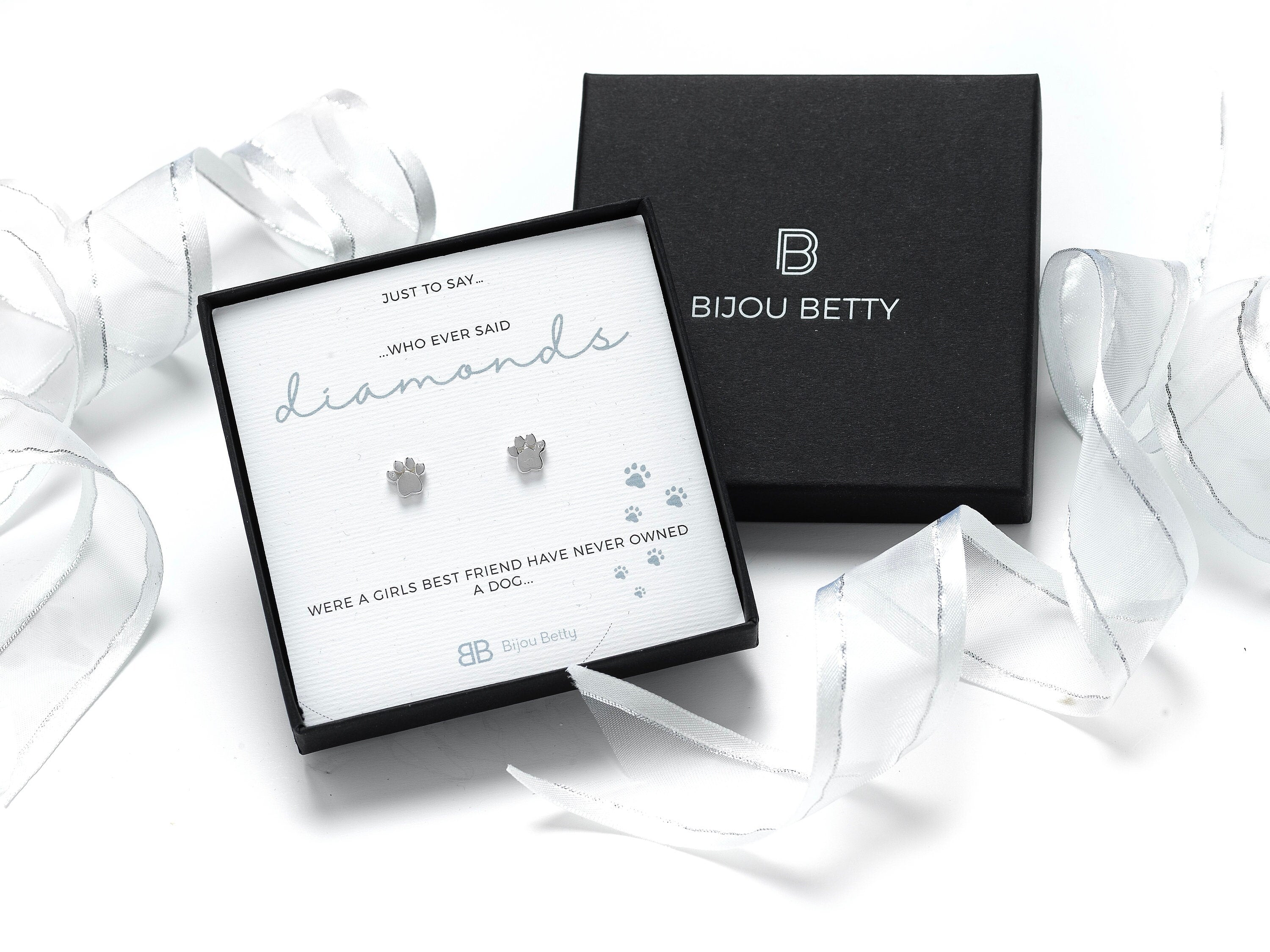 Sterling silver paw print stud earrings in gift box.
