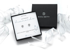 Sterling silver paw print stud earrings in gift box.