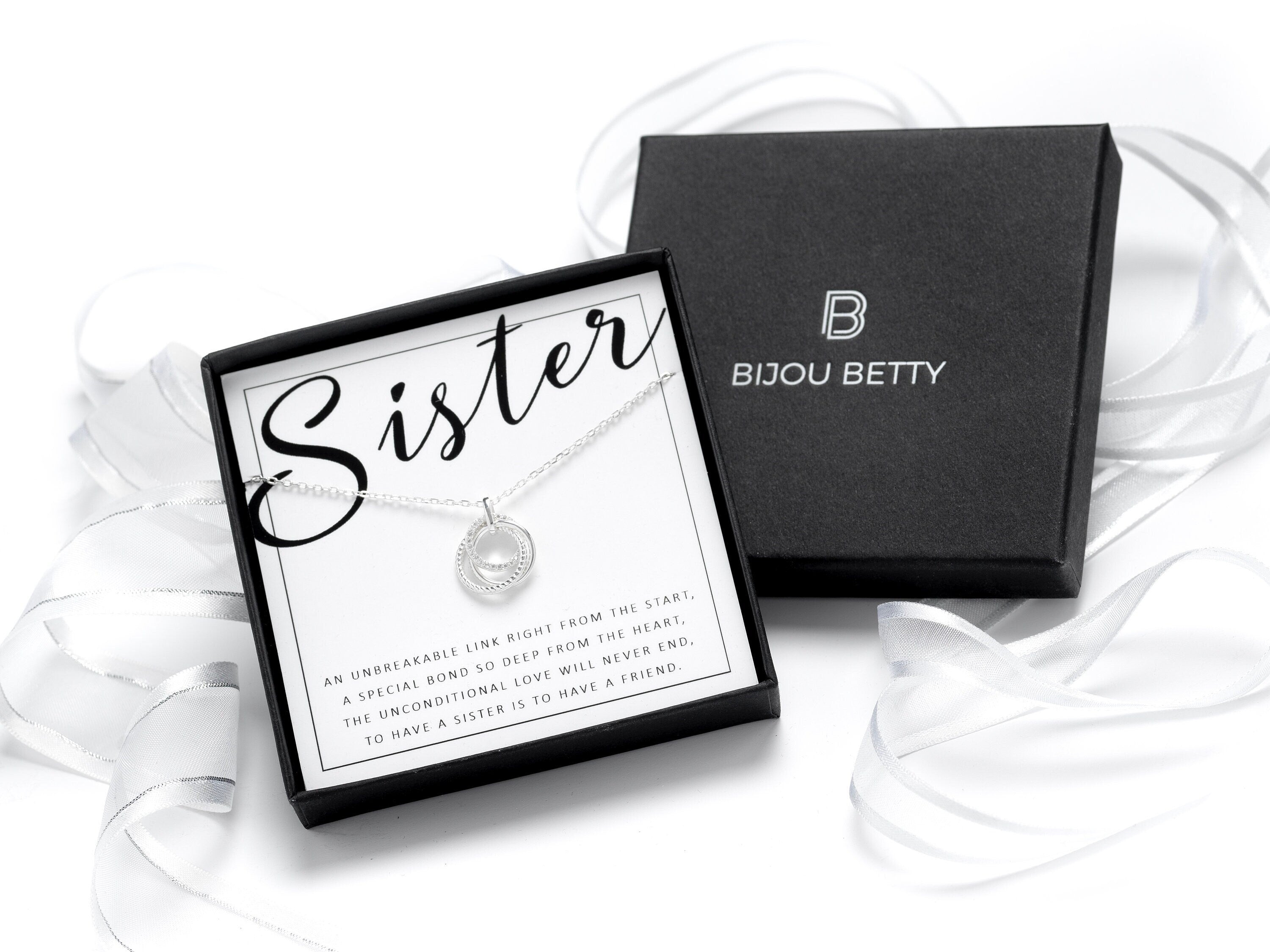 Sterling silver sister circle necklace with CZ stones.