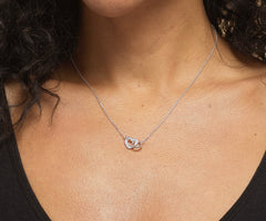 Model wearing sterling silver You've Got This heart necklace.