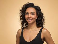 Model wearing Bijou Betty’s 925 sterling silver 30th birthday necklace, featuring a three-heart pendant on a 16–18 inch adjustable chain.