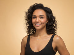 Model wearing a 3 heart silver friendship necklace.