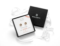 Sterling silver 50th birthday earrings with black CZ in Bijou Betty gift box.