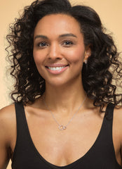 Model wearing sterling silver interlinked circles necklace.