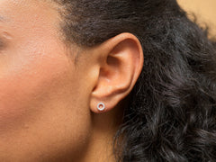 Model wearing sterling silver 13th birthday open circle earrings.