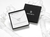 Sterling silver necklace with a cubic zirconia heart and interlinked circle, symbolising sisterly bonds. Adjustable 16-18 inches. Perfect gift for sister on birthdays, Christmas, or special occasions. Includes gift box, bag, tissue, and message card.