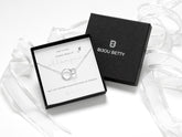 Sterling silver interlinked necklace or bracelet with two circles, adjustable length, presented in a Bijou Betty gift box with a matching bag. Includes a card reading, 'Chance made us colleagues, but fun made us friends.' A thoughtful, timeless gift.