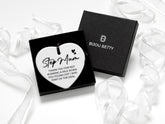 Ceramic heart keepsake with black ribbon, featuring the message: Step mum - thank you for not running a mile when you found out I was part of the deal. Perfect gift for step mum's birthday, Christmas, or just because. Optional gift box available.