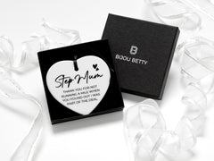 Ceramic heart keepsake with black ribbon, featuring the message: Step mum - thank you for not running a mile when you found out I was part of the deal. Perfect gift for step mum's birthday, Christmas, or just because. Optional gift box available.