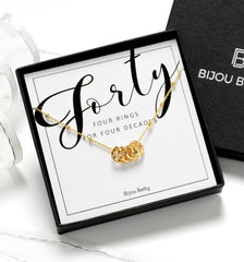 Gold-plated 40th birthday 4 ring necklace in gift box with bag.