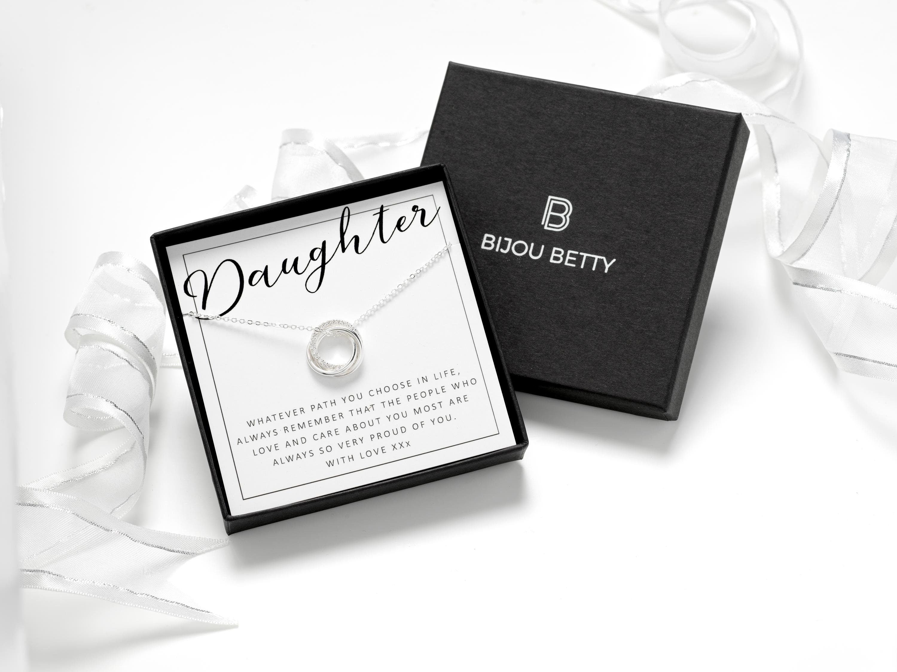silver necklace with 3 interlocked rings, one with cubic zirconia. Perfect gift for daughter on birthday, Christmas, graduation, or wedding. Includes luxury gift box, bag, tissue, and ribbon.