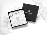 Sterling silver necklace with 3 interlocked rings, one with cubic zirconia. Perfect gift for daughter on birthday, Christmas, graduation, or wedding. Includes luxury gift box, bag, tissue, and ribbon.