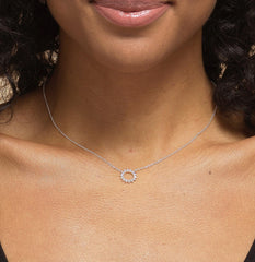 Model wearing sterling silver 30th birthday sunburst necklace.