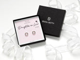 Sterling silver open circle earrings with black cubic zirconia stones on a heartfelt message card for daughter-in-law gifts.