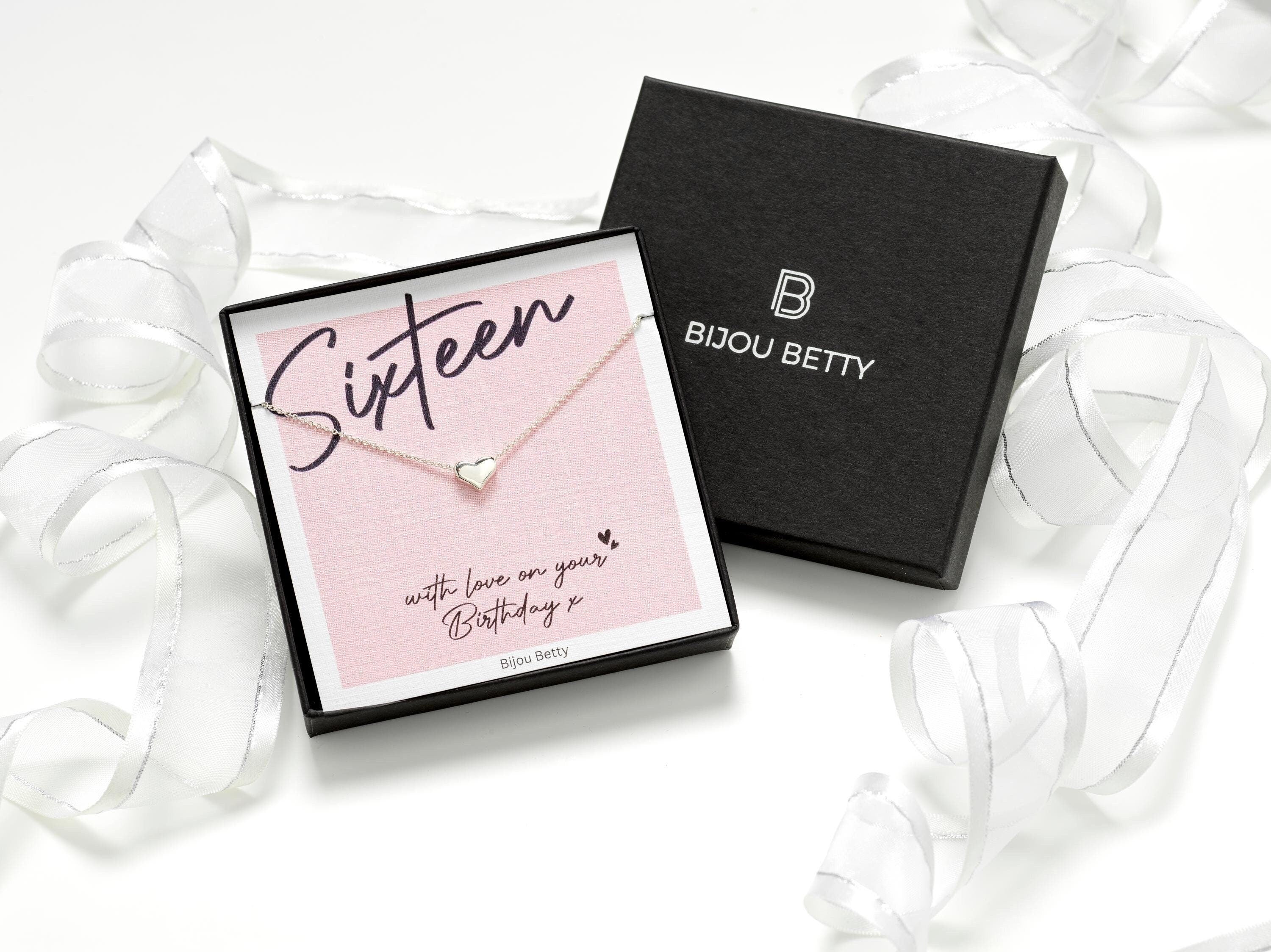 Sterling silver heart necklace with dainty 9mm heart pendant, available in silver, gold, and rose gold finishes, beautifully packaged with a "Sixteen - With love on your Birthday x" message card.