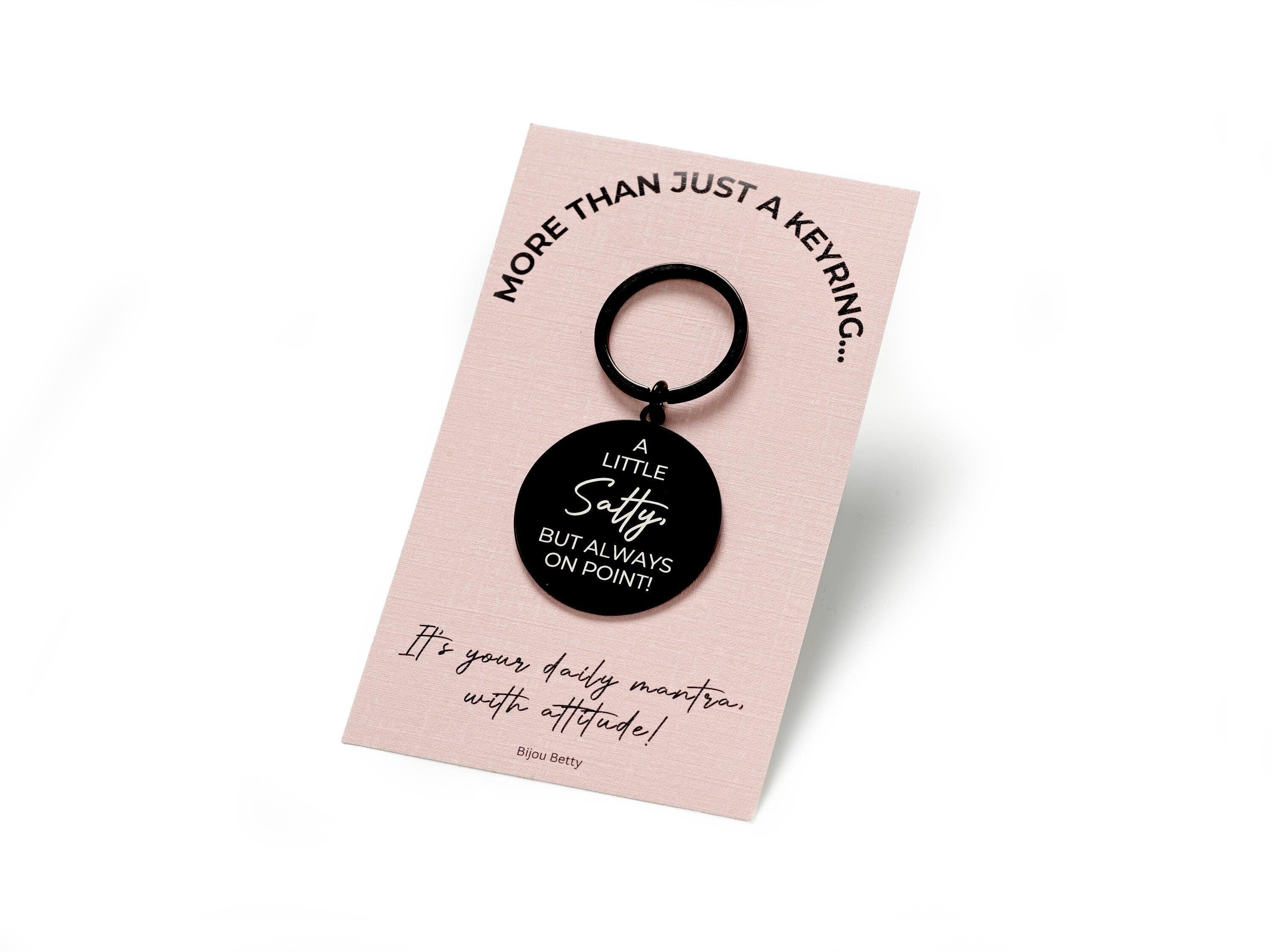 Stainless steel keyring engraved with the quote 'A little salty, but always on point!', perfect as a fun gift for friends, sisters, or colleagues.