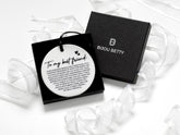 Ceramic round friendship gift (75mm diameter) with best friend quote and black satin ribbon, wrapped in tissue paper, optional gift box or bag.